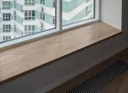 Photo of plastic windows in an apartment with a window sill