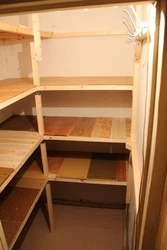 Photo of a storage room in an apartment with do-it-yourself shelves