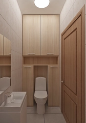 Design Of A Toilet In An Apartment With A Cabinet And Tiles