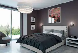 Curtains in the interior of a bedroom with a gray bed