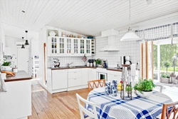 White kitchen design in a country house