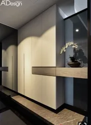 Hallway cabinet design opposite the door