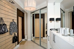 Hallway cabinet design opposite the door