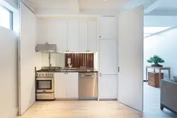 Kitchen design with refrigerator and table
