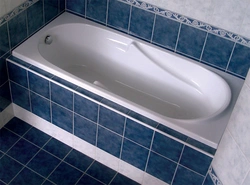 Photo Of The Bathtub Covered With Tiles