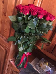 Photo of one rose in the kitchen