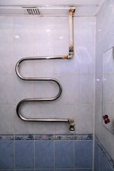 Photo Of Bathtub Tiles And Pipes