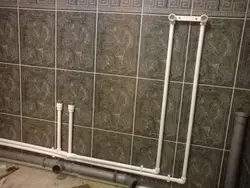 Photo Of Bathtub Tiles And Pipes