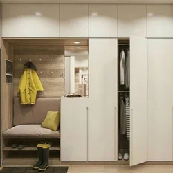 Hallway closet with ottoman photo