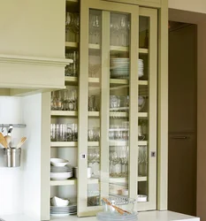 Kitchen utensils behind glass photo
