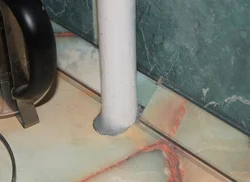 Photo of kitchen pipes in countertop