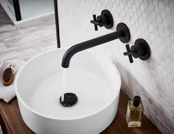 Black taps in the bathroom photo