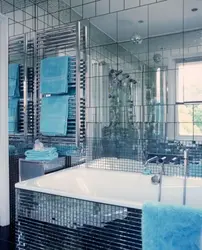 Bathtub with mirror wall photo