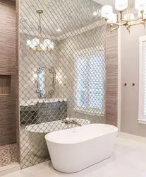 Bathtub with mirror wall photo