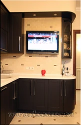 Kitchen photo with microwave and TV