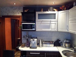 Kitchen photo with microwave and TV