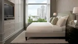 Bed side view in bedroom photo
