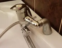 Install faucet on bathtub photo