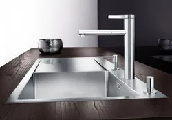 Stainless steel kitchen faucet photo