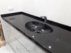 Dark countertop in the bathroom photo