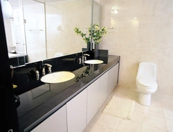 Dark Countertop In The Bathroom Photo