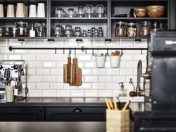 Black shelves in the kitchen photo