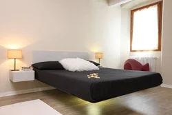Bedroom bed with legs photo