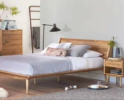 Bedroom bed with legs photo