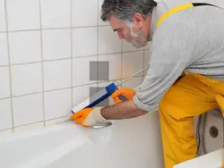 White sealant for bathtub photo