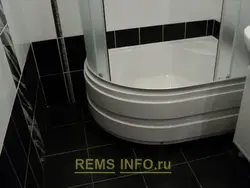 Photo of a bathtub with a deep tray