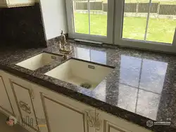 Kitchen with cast countertop photo