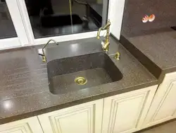 Kitchen with cast countertop photo