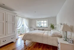 Bedroom in a white house photo