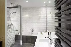 Bathtub with brick panels photo