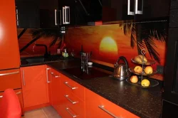 Orange kitchen black countertop photo