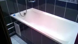 Acrylic bathtub in tiles photo