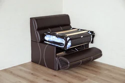 Folding sofa with sleeping place photo