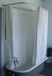 Bathtub with shower curtain photo