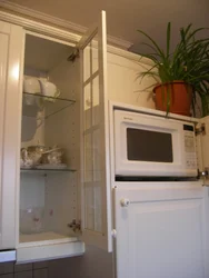 Photo of refrigerator and microwave in the kitchen