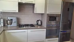 Photo of refrigerator and microwave in the kitchen