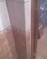 Photo of bathroom tiles near the door