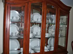 Dishes on the wall in the living room photo