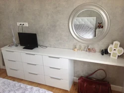 Table and chest of drawers in the bedroom photo