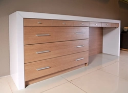 Table and chest of drawers in the bedroom photo