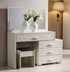 Table and chest of drawers in the bedroom photo