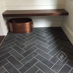 Tiles from bathtub to hallway photo