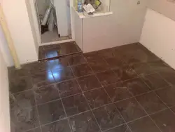 Tiles from bathtub to hallway photo