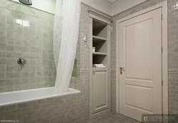 Bathroom door made of tiles photo