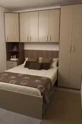 Bedroom interiors with bed and wardrobe photo