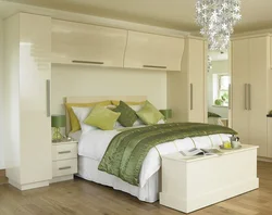 Bedroom interiors with bed and wardrobe photo